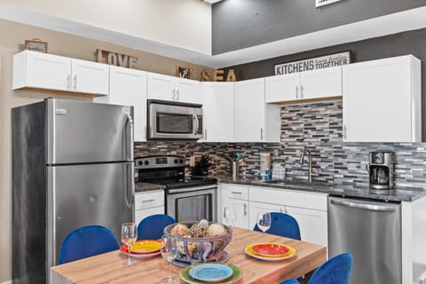 Fully Stocked Kitchen and Dining Area