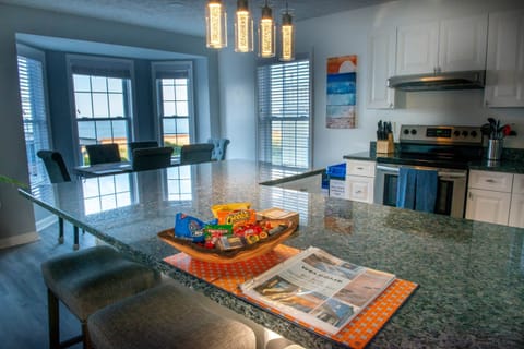Large fully stocked kitchen with snacks, coffee, large island and beach views