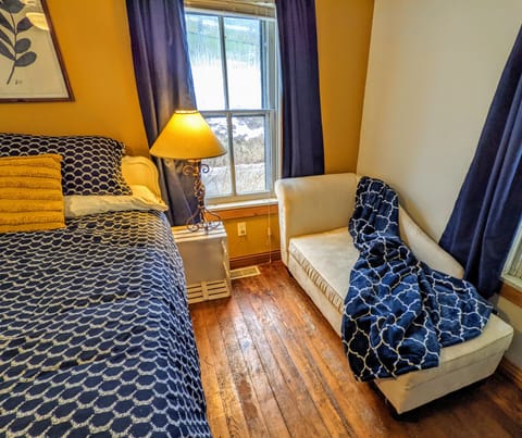 Master bedroom: chaise lounge is great for cozy reading, retreating from chaos.