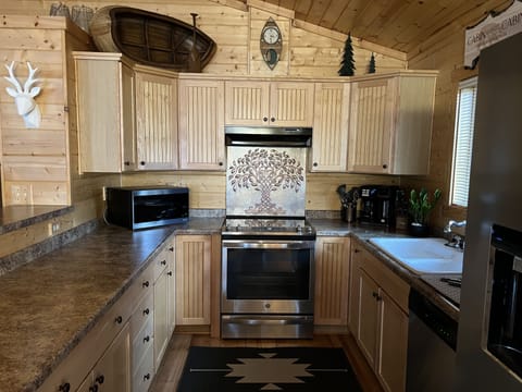 Well provisioned kitchen with new appliances.