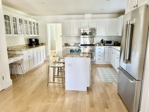 All new Thermador appliances, bar seating for four and built in desk