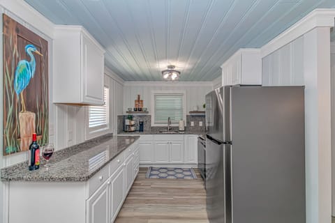 Cook your meals in this fully stocked kitchen with coffee bar. 
