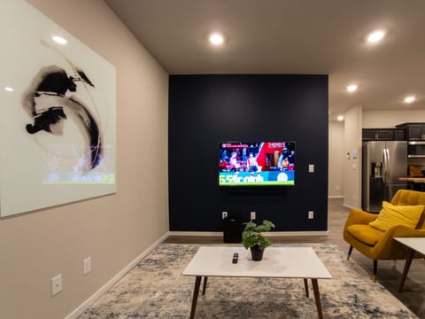 Living room with comfy couch, 55-inch smart tv w/espn/hulu/disney+/prime-video