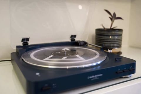 Record playing, with selection of records, in dining room