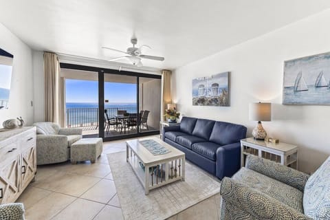 Living room w/ access to the large patio and views of the ocean.