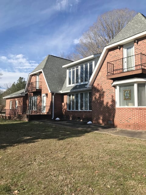 Stately 1.5 story brick home on 7+ level acres with barn. Plenty of space!