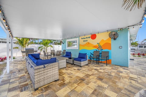 Cozy outdoor seating area with vibrant decor, perfect for relaxation and gatherings.