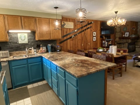 Fully stocked kitchen and gas grill on the deck.