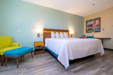 Unwind into crisp linens and a plush, restful bed.