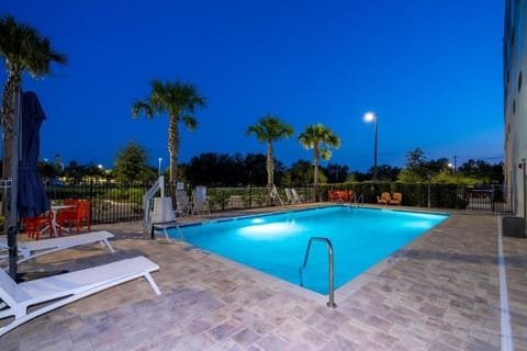 Unwind after dark with a glowing, tranquil swim.
