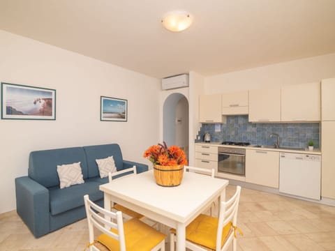 Furniture, Cabinetry, Table, Property, Couch, Countertop, Interior Design, Lighting, Wood, Houseplant