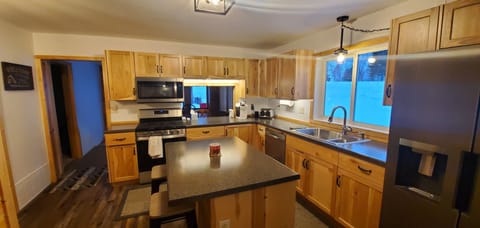 Kitchen with island and a pass-thru to Dining Rm