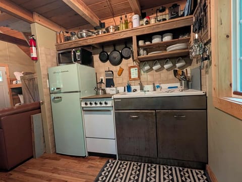 The cabin now features a brand new 2025 frigidaire refrigerator!