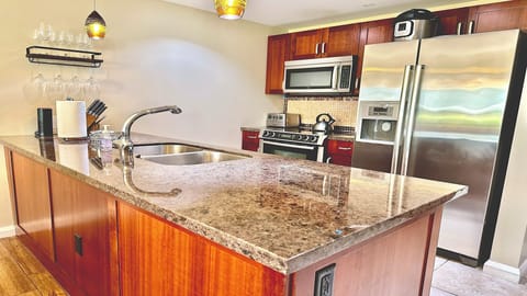 Bosch appliances, granite counter top, knife set, wine glass rack, Amazon Alexa.