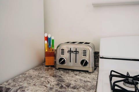 Kitchen has all the amenities for eating in.