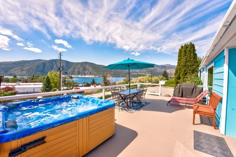 Enjoy the lake and mountain views from your private deck with hot tub, gas grill