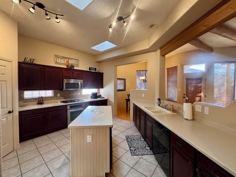 Island in kitchen available for additional counter space.