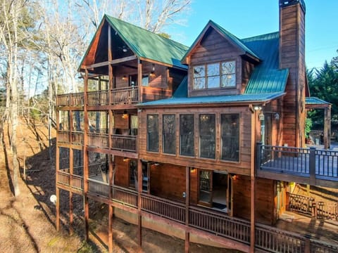 The property is "All Decked Out" with triple decker wrap around decks,