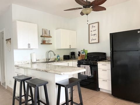 Clean and airy kitchen equipped with everything you need.