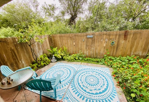 Downstairs fenced patio facing the green belt/air strip