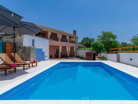 Water, Sky, Building, Property, Swimming Pool, Azure, House, Shade, Outdoor Furniture, Chair