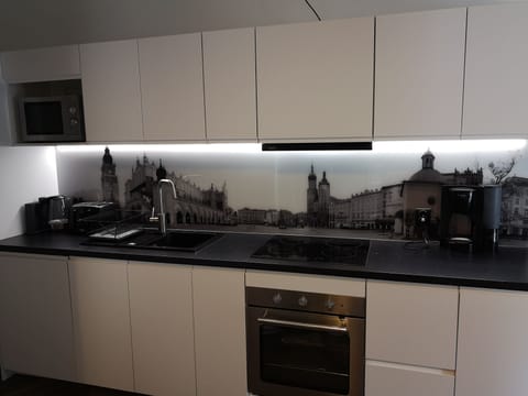 Kitchen is fully equipped with all necessary kitchenware.