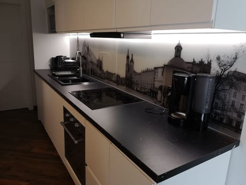 Kitchen is fully equipped with all necessary kitchenware.