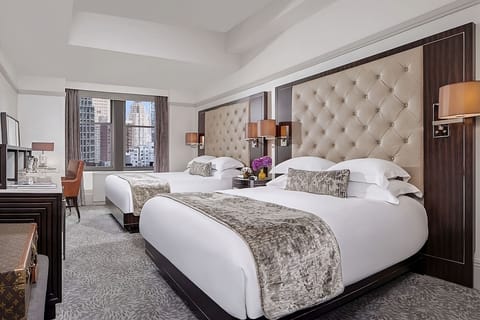 Stretch out together in two plush beds with airy space.