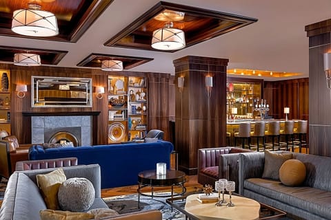 Unwind in a stylish lounge with warm, ambient lighting.