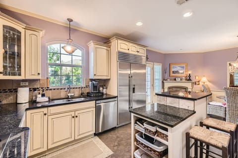 Here is another angle of your spacious and well-lit kitchen.