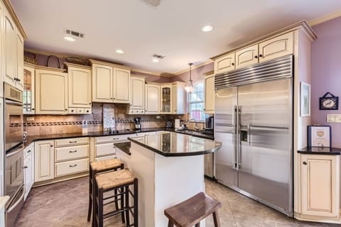 Spacious kitchen with modern appliances and ample counter space.