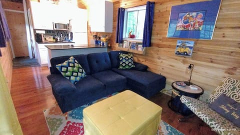 View of LR to Kitchen. New Sectional couch with Chaise, Convertible ottoman .