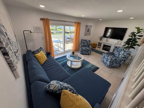 Main living area: 65” Smart TV with cable/streaming capabilities; large deck
