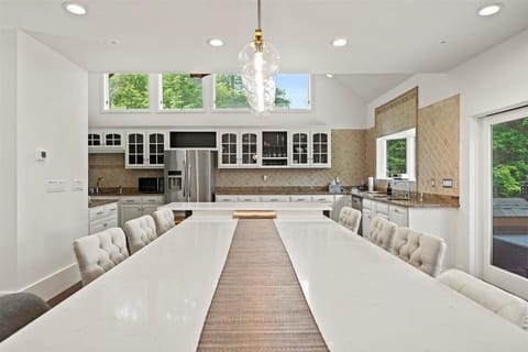 Big kitchen opening up to the patio with a full length patio door.
