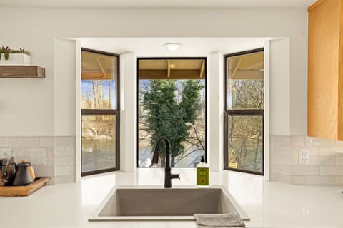 Views of the river from the kitchen also. Herbs growing in pots on patio can be used for your meal du jour.