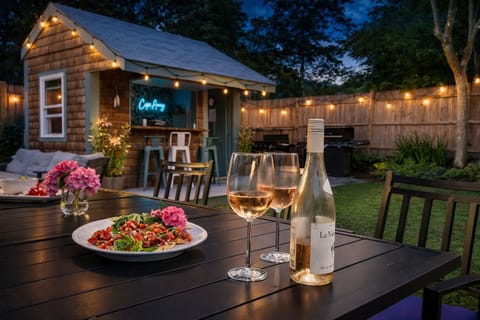 Patio with a Polywood dining set that seats 8 guests featuring an umbrella  
