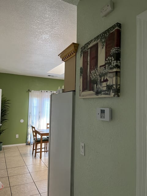 On the way to the kitchen is your air/heat thermostat for your comfort.