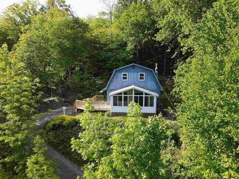 Perched on a hill across from the pond