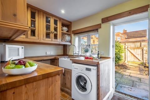 Ground floor: The kitchen door opens to the courtyard garden