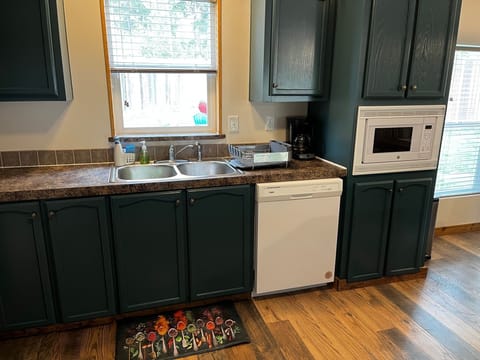 Kitchen has dishwasher and microwave