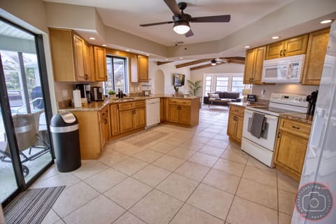 Large, open plan kitchen with all the required equipment + access to patio.