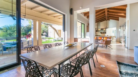 8 person indoor dining table w/ panoramic doors for indoor/outdoor experience