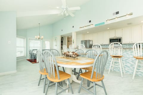 6 more can sit at the second dining table