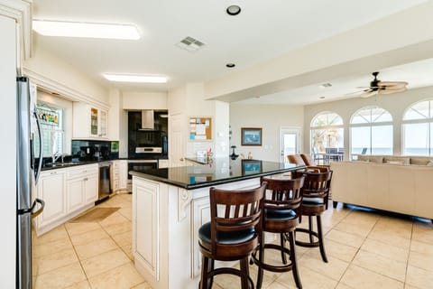 Easily serve meals from the adjacent kitchen