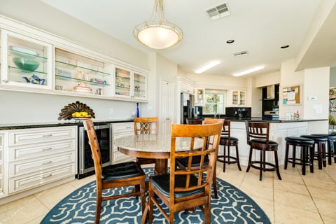 Easily enjoy family time in the open dining and kitchen area