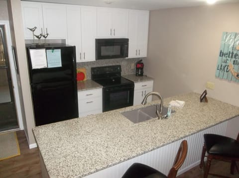 Fully equipped kitchen with newer appliances and granite counter tops