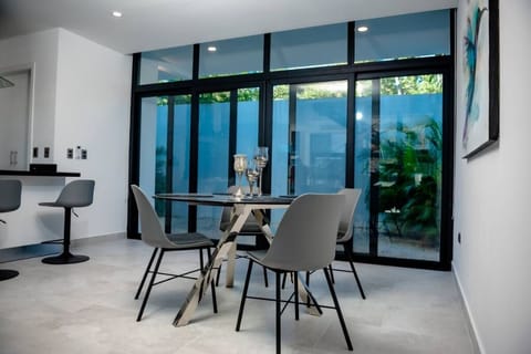  Stylish 4-seater dining set, ideal for enjoying meals in a cozy space.