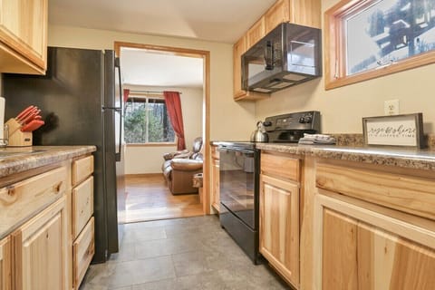 Galley kitchen leading into living space