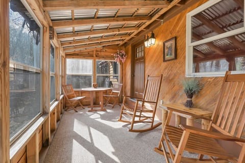Sunroom with a view of the woods