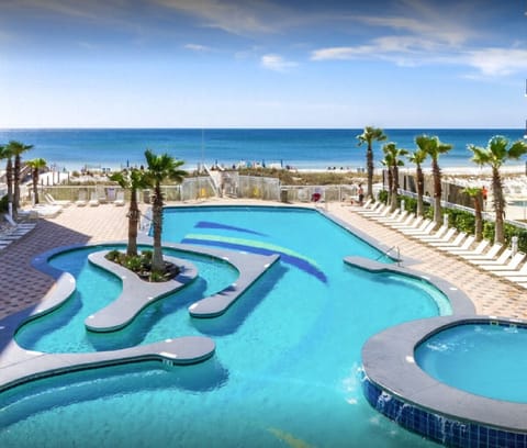 Beachside Pool/Lazy River - Dive into relaxation with our sparkling pool, just steps from the sandy beach.  Unwind and soak up the sun in paradise.